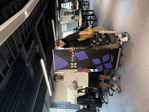 Two of the team beside the ikigai Launchpad banner