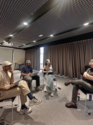 The team heads-down on laptops in a workshop session